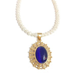 Pearl necklace with Blue Cat's eye glass pendant in Gold setting